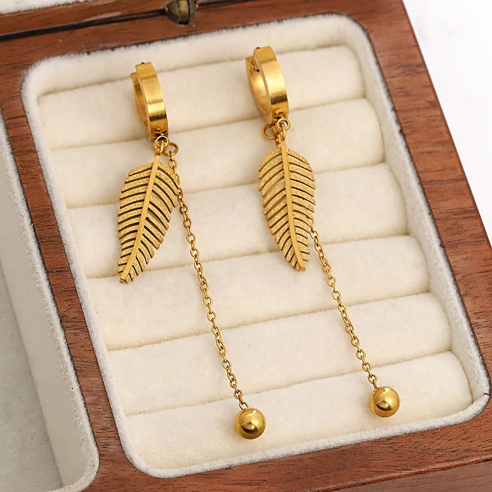 Lucia Gole: Stainless Steel Gold Color Sparkling Feather Leaf Tassel Hoop Earrings - Lucia Gole