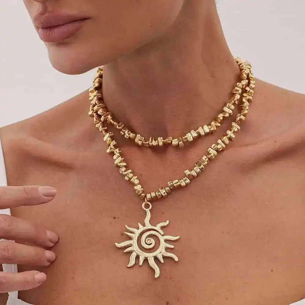 Lucia Gole – Gold Spiral & Sun Pendant Necklace
